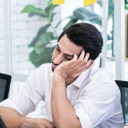 Tired man in meeting